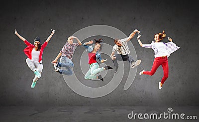 Group of teenagers jumping Stock Photo