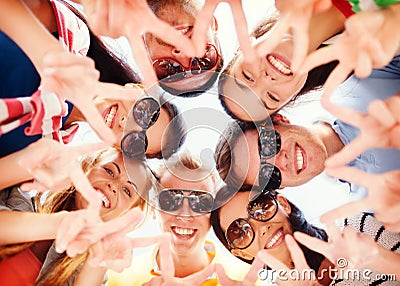 Group of teenagers showing finger five gesture Stock Photo