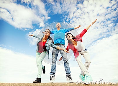 Group of teenagers spreading hands Stock Photo
