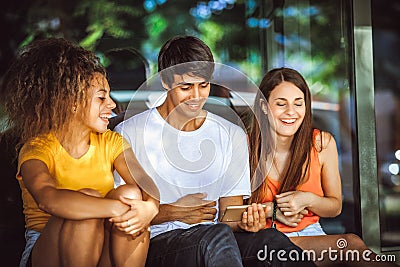 Group of teenagers on the street with CellPhones Stock Photo