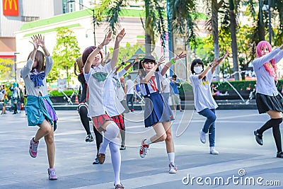 Group of Thai cosplayers dancing like cover girls for public show Editorial Stock Photo