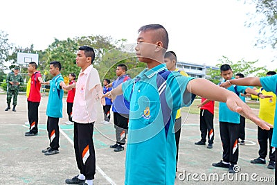 Group of Thai student are doing exercise together in the basketball field in the morning at Paknampran wittaya school Hua Hin, Th Editorial Stock Photo