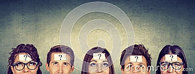 Group of thinking people with question mark looking up Stock Photo