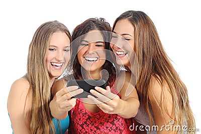 Group of three teenager girls laughing looking the smart phone Stock Photo
