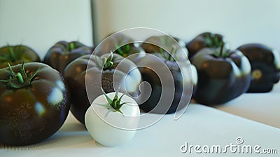 A group of tomatoes are arranged in a row with one tomato being smaller than the rest, AI Stock Photo