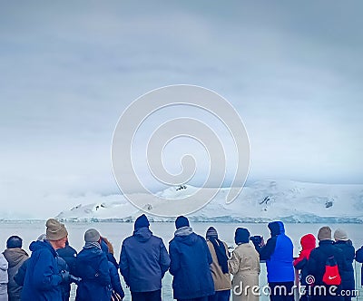 A group of tourist watching beautiful glacier in Antarctica on a cruise ship Editorial Stock Photo