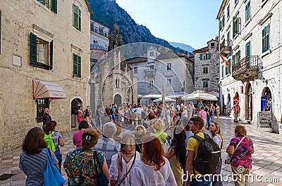 Group of tourists near church of St. Luke, Old Town, Kotor, Montenegro Editorial Stock Photo