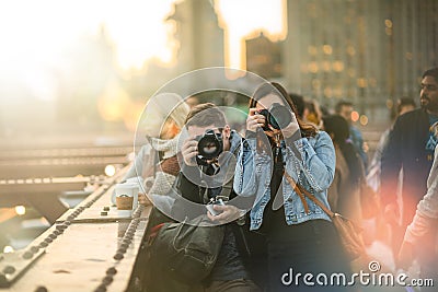 Group of Tourists Photographers on the Brooklyn Bridge during Sunset Editorial Stock Photo