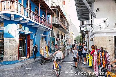 Group of tourists riding bicycles through the streets of the historic center in Cartagena de Indias Editorial Stock Photo