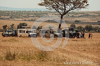 A group of tourists in Savannah Grassland in Masai Mara, Kenya Editorial Stock Photo