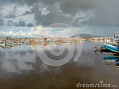 A group Traditional fishing boats docked in the harbor with nature Background Editorial Stock Photo