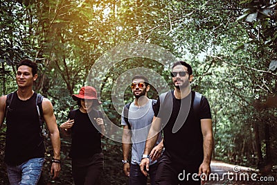 Group of traveler friend walking together at rain forest,Enjoying backpacking concept Stock Photo