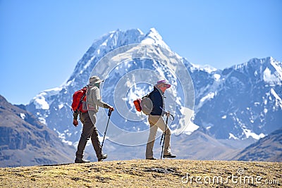 A group of trekkers on the Ausangate trail in the Peruvian Andes Editorial Stock Photo