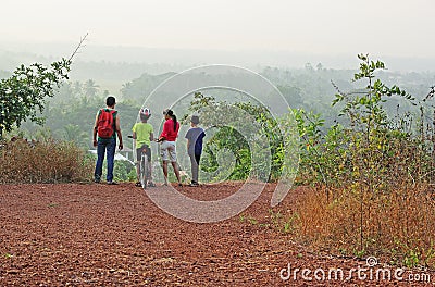 Group Trekking in Scenic Hilly Countryside Stock Photo