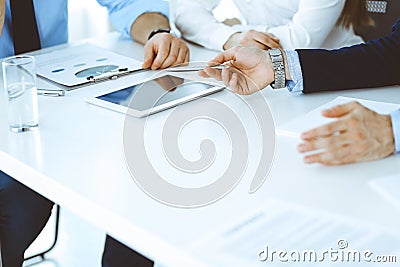 Group of unknown business people discussing questions at meeting in modern office, close-up of hands. Managers at Stock Photo