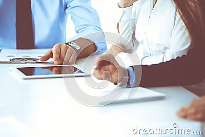 Group of unknown business people discussing questions at meeting in modern office, close-up of hands. Managers at Stock Photo