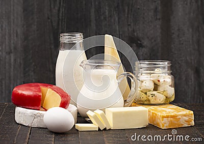 Group of Various Dairy Foods on a Rustic Wooden Table Stock Photo