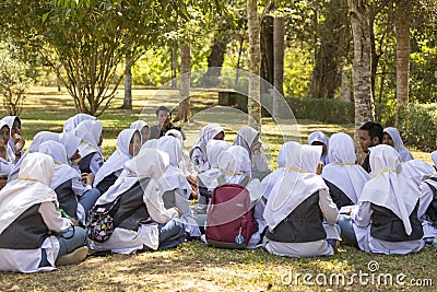 Muslim girls from some local school enjoy a meeting with their history teacher close to the Borobudur temple Editorial Stock Photo