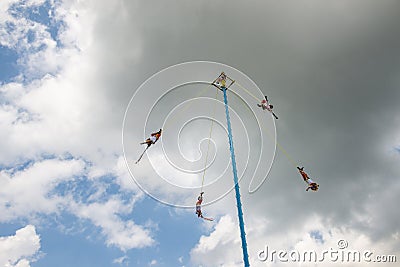 A group of voladores flyers performing the traditional Danza de los Voladores Dance of the Flyers in Papantla Editorial Stock Photo