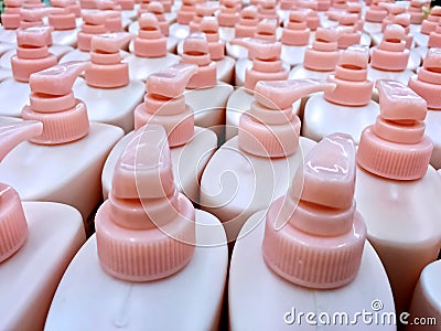 Group of White Bottles of Shampoo or Body Lotion with Dispenser Stock Photo