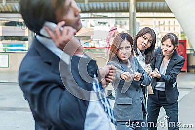 Group of woman pulling a rope competing with a businessman Stock Photo
