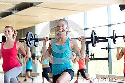 Group of women with barbells in gym Stock Photo