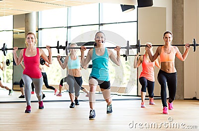 Group of women with barbells in gym Stock Photo