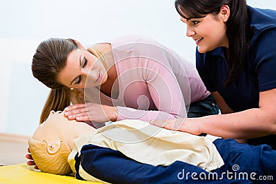 Group of women in first aid class exercising reanimation Stock Photo