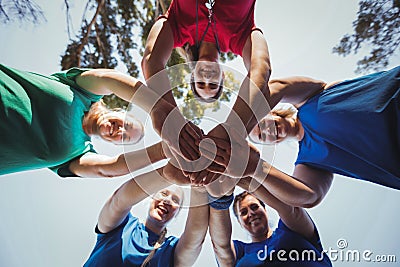 Group of women forming hand stack in the boot camp Stock Photo