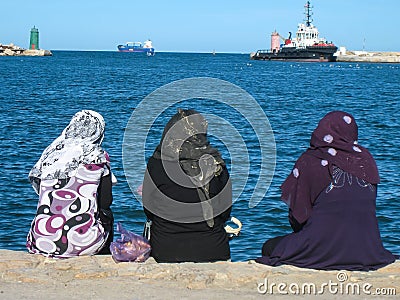 Women chilling out at the harbour. Sousse. Tunisia Editorial Stock Photo