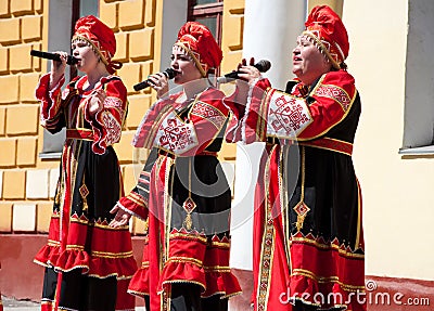 The group of women sing a song, wearing traditional Russian clothes in Moscow. Day of Victory, May 9,2014. Editorial Stock Photo