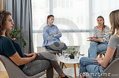 Group of women victims of robbery, violence, infidelity and other bad and negative experiences and crimes on support group psychot Stock Photo