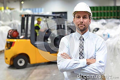 Group of workers in the logistics industry work in a warehouse w Stock Photo