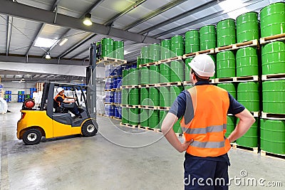 Group of workers in the logistics industry work in a warehouse w Stock Photo