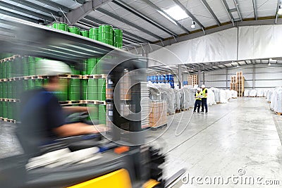 Group of workers in the logistics industry work in a warehouse w Stock Photo