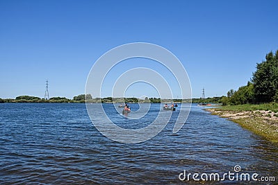 A group of young adults kayaking on a lake in summer Editorial Stock Photo