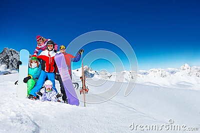 Group of young adults snowboarders in the mountain Stock Photo