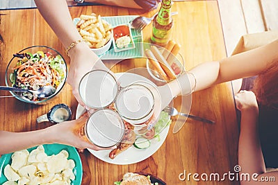 Group of young asian people celebrating beer festivals happy while enjoying home party Stock Photo