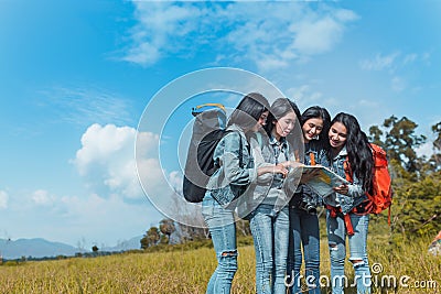 Group of Young Asian women looking map travel trekking Stock Photo