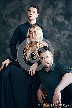 Group of young beautiful people posing in studio Stock Photo