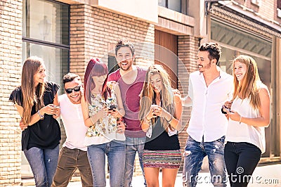 Group of young best friends having fun together walking in town Stock Photo