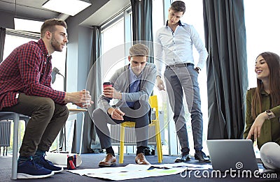 Group of young business people and designers. They working on new project. Startup concept. Stock Photo