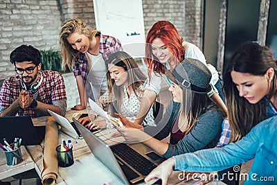 Group of young business people in smart casual wear working together Stock Photo