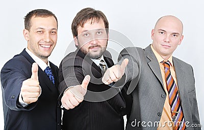 Group of young businessmen together on light backg Stock Photo