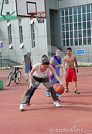 Pengzhou, China: Youths Playing Basketball Editorial Stock Photo