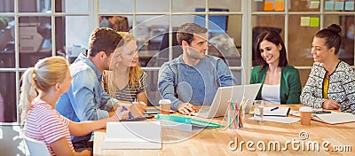 Group of young colleagues using laptop Stock Photo