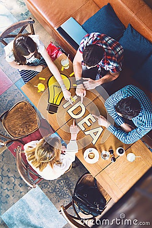 Group of young and creative people at the table, talking Stock Photo