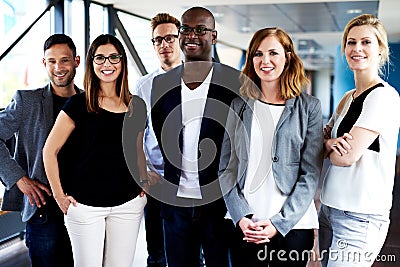 Group of young executives posing for picture Stock Photo