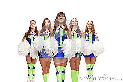 Group of young female cheerleaders team are standing with pom-pom`s on background Stock Photo