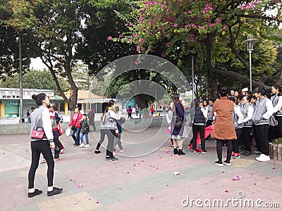 Shenzhen, China: young women employees are doing activities outdoors Editorial Stock Photo